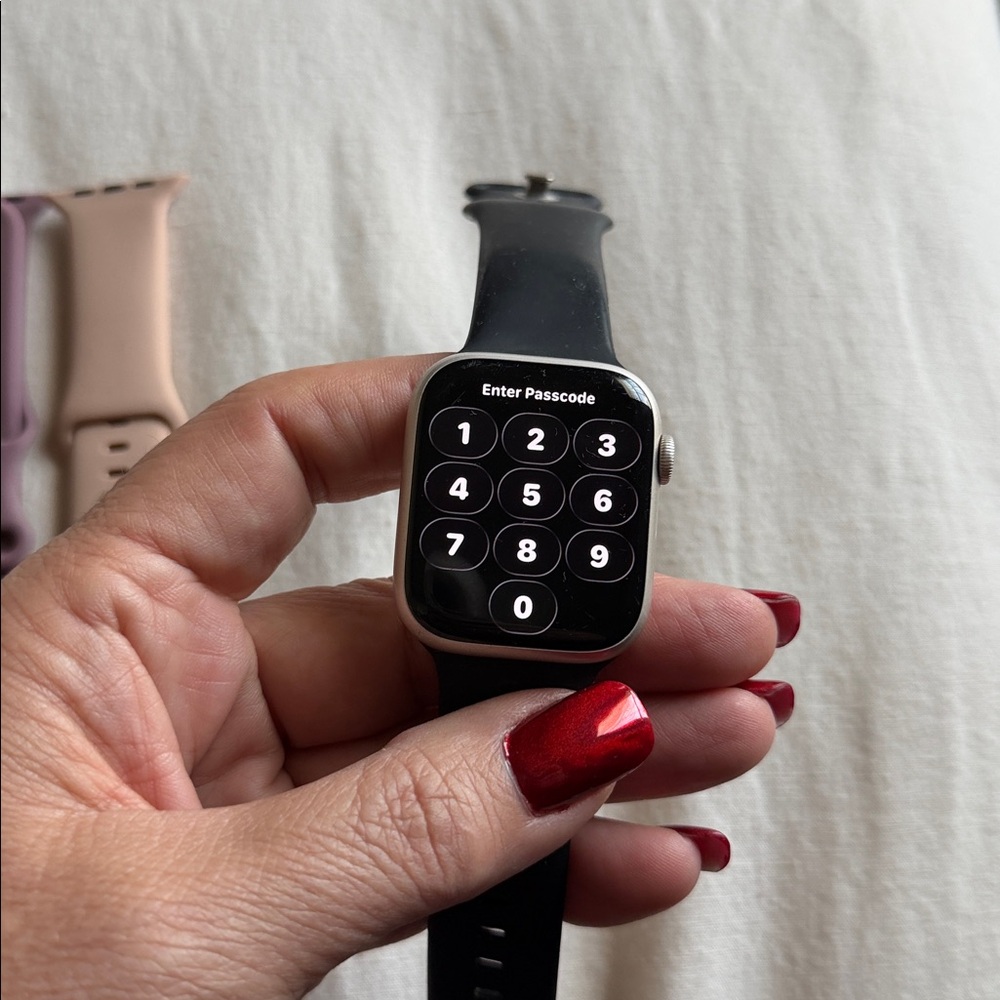 Apple Watch with Black, Purple, and Tan Bands - Picture 2 of 3